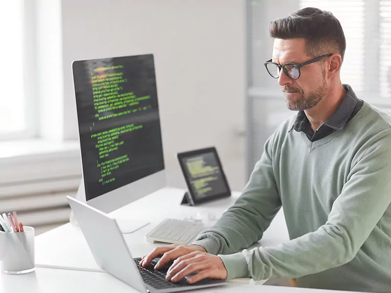 person operating a laptop